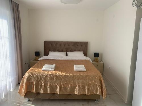 Postel nebo postele na pokoji v ubytování DINA LUX Apartman