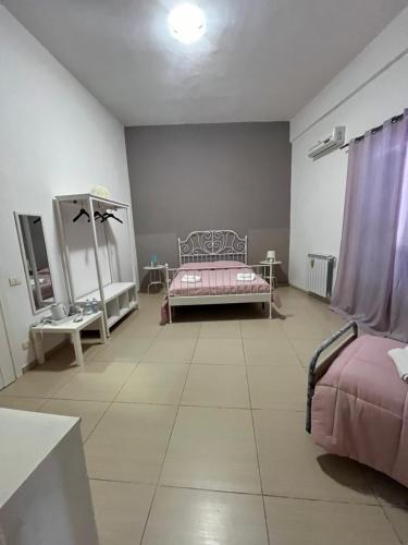 Postel nebo postele na pokoji v ubytování PERSEFONE LUXURY SUITE