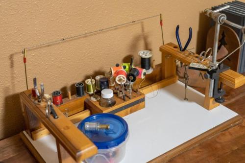 a kitchen counter with a sewing machine on a table at Uncle Terry's Cabin in Rigby