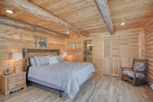 a bedroom with a bed in a log cabin at Trout Trap at Henry's Lake in Island Park