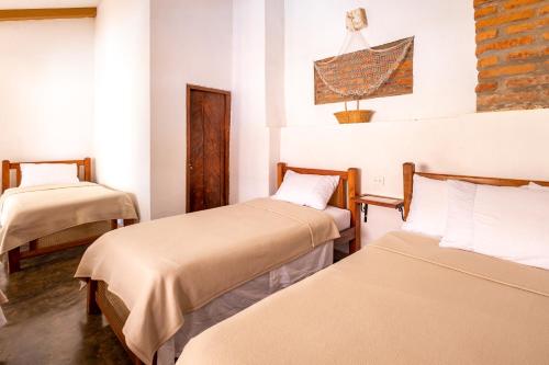 Postel nebo postele na pokoji v ubytování Albarrada Hotel Boutique