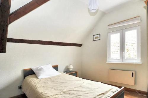 Posteľ alebo postele v izbe v ubytovaní Maison de charme avec jardin à Ingersheim - Chaleur cosy