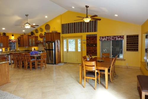 a kitchen and dining room with a table and chairs at Breathtaking Views Close to Yellowstone in Island Park