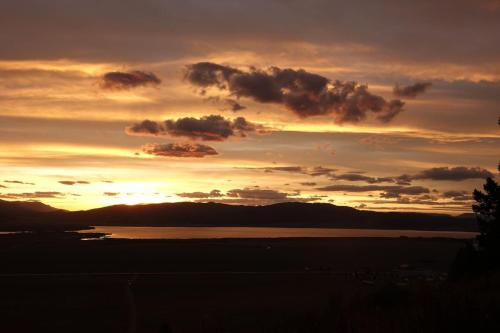 a sunset over a body of water with clouds at Breathtaking Views Close to Yellowstone in Island Park