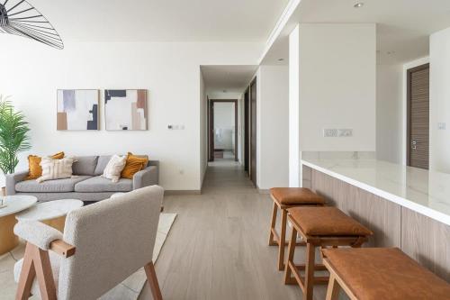 a living room with a couch and a table at Frank Porter - One Park Avenue in Dubai
