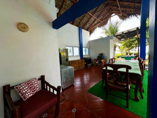 a kitchen and dining room with a table and chairs at Casa Maria in El Cebollito
