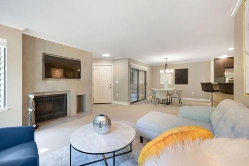 a living room with a couch and a fireplace at 115 Modern and Serene Min to Downtown in Bellevue