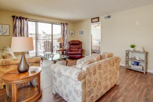 a living room with a couch and a table at Beautiful Brigantine Condo with Patio and Beach Access in Brigantine