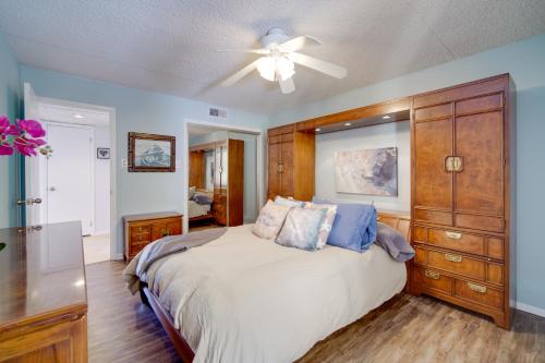 a bedroom with a bed and a ceiling fan at Beautiful Brigantine Condo with Patio and Beach Access in Brigantine