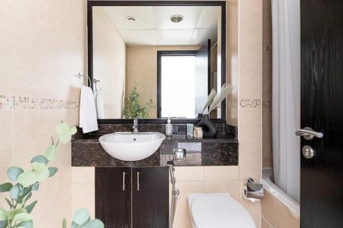 a bathroom with a sink and a mirror at Frank Porter - Goldcrest Views 2 in Dubai