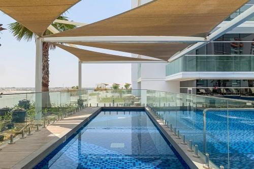 a swimming pool on the roof of a building at Frank Porter - Carson A in Dubai Marina