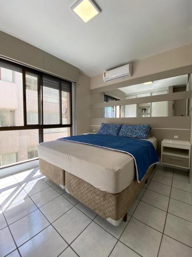 Un pat sau paturi într-o cameră la Ap à Beira-Mar em Atlântida