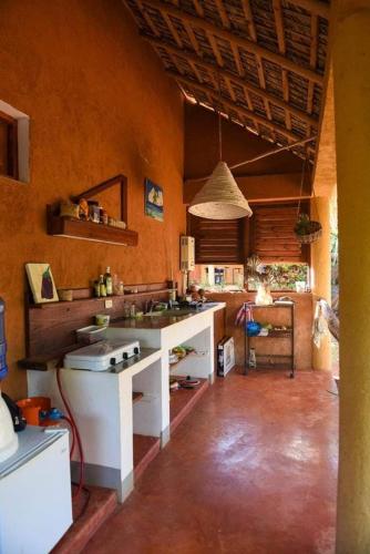 a kitchen with a sink and a stove in it at Eve Getaway in Madama