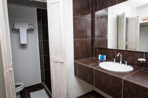 a bathroom with a sink and a mirror at Sol Caribe Campo All Inclusive in San Andrés