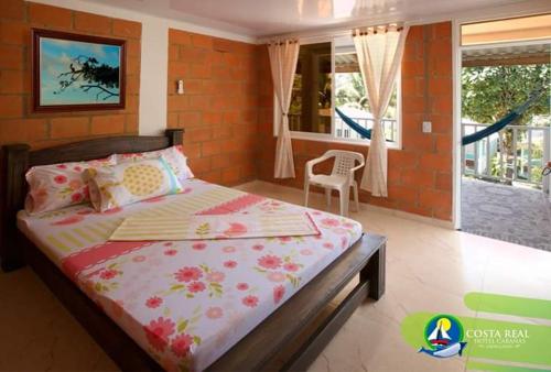 Ένα ή περισσότερα κρεβάτια σε δωμάτιο στο Hotel Costa Real