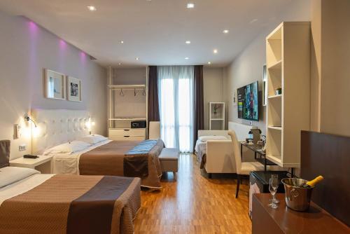Postel nebo postele na pokoji v ubytování Hotel Orcagna