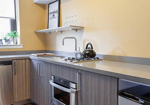 a kitchen with a sink and a counter top at Lovely1BR Apartment in Midtown in New York