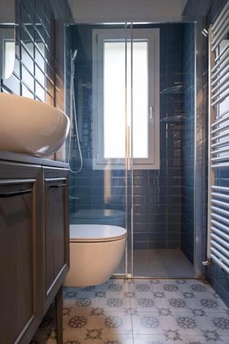 a bathroom with a tub and a shower and a sink at Casa Cate Cervia Centralissima in Cervia