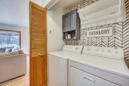 a laundry room with a washer and dryer at Pet-Friendly Colorado Springs Home with Mtn Views! in Colorado Springs