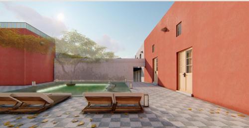 a courtyard with chairs and a pool in a building at Palacio Guaqui by Ananay Hotels in Arequipa