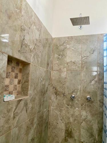 a bathroom with a shower with a glass door at Departamento Océano in La Paz