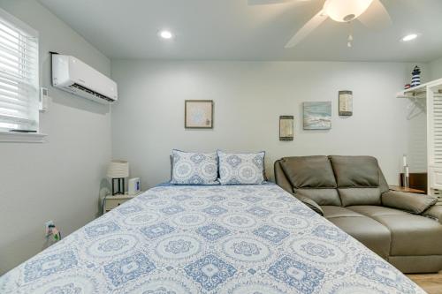 a bedroom with a bed and a couch at Quaint Texas Studio 1 Mi to Rockport Beach! in Rockport