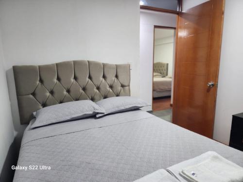 En eller flere senge i et værelse på Villa Paraiso Apart