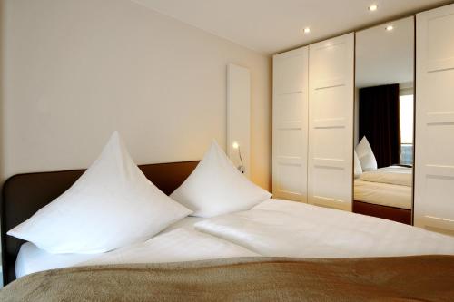 Säng eller sängar i ett rum på Passepartout