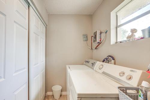 a bathroom with a white sink and a mirror at Private and Picturesque Escape on Lake Henry! in Lake Placid