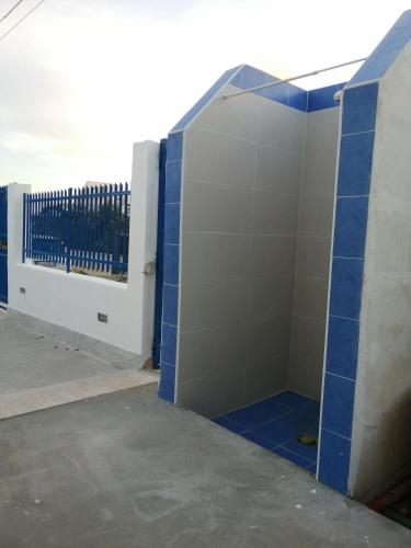 a wall with blue tile on the side of a building at Villa Sunshine in Triscina