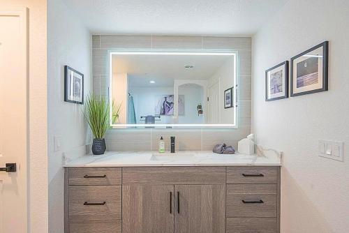 a bathroom with a sink and a large mirror at Golf View Oasis-Serenity-Tranquility-Walkability N244 in Scottsdale