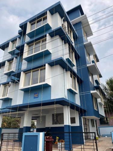 a blue building with ropes hanging from it at Sai Homestay Panaji Studio in Panaji