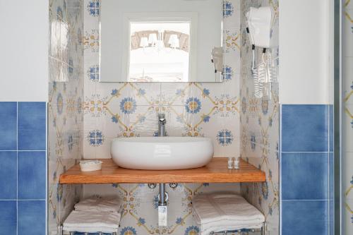 a bathroom with a sink and a mirror at Villa Prota in Vico Equense