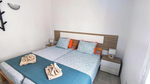 Giường trong phòng chung tại Apartamento El Bomboncito, a un tiro de la playa!