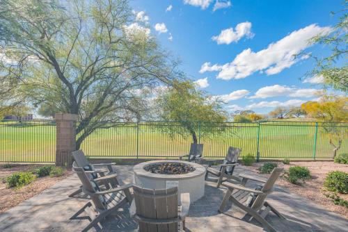 a patio with three chairs and a fire pit at Remodeled King Bed Suite Sonoran Sunset Lounge in Scottsdale