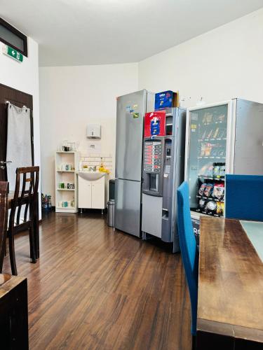 a room with a bunch of refrigerators in a kitchen at Central Hostel Partener in Oradea