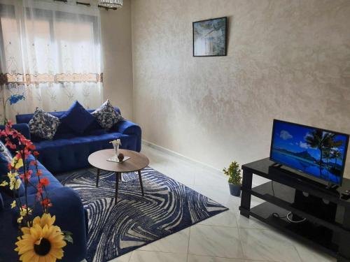 TV a/nebo společenská místnost v ubytování Appartement Dar Meknès
