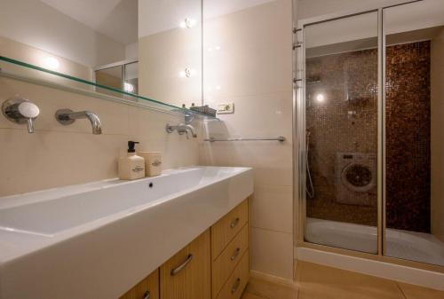 a bathroom with a sink and a shower at Luxury apartment Eni on the West Coast in Split