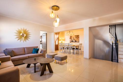 a living room with a couch and a table at Villa Danai in Karpathos Town