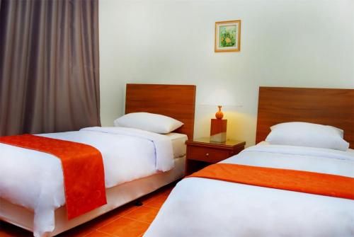 Ένα ή περισσότερα κρεβάτια σε δωμάτιο στο Baduy Condo AA