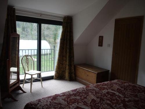Кровать или кровати в номере The Annexe at Riverside Cottage