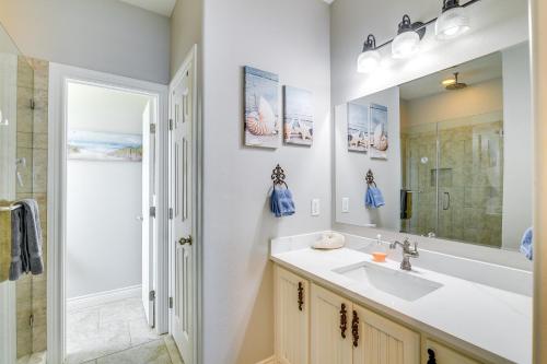 a bathroom with a sink and a mirror at Modern Crystal Beach Escape, Walk to Beach! in Crystal Beach