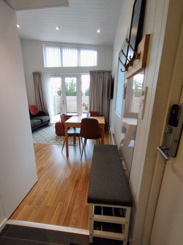 a living room with a table and a dining room at Bålsta Studio Houses in Bålsta