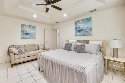 a bedroom with a bed and a couch at Pet-Friendly San Juan Home with Private Yard and Grill in San Juan