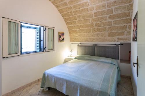 Voodi või voodid majutusasutuse Villetta Jasmine con giardino Torre Pali toas