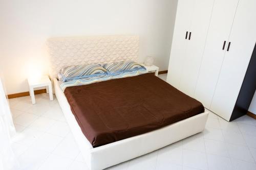 Postel nebo postele na pokoji v ubytování Appartamento Nettuno