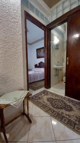 a room with a bedroom with a bed and a door at ΑΡΜΟΝΙΑ MountHome awesome stay in Arachova