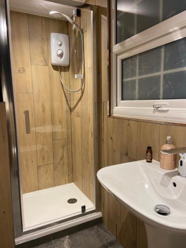 a bathroom with a shower and a sink at The Garden Tent in Whitchurch
