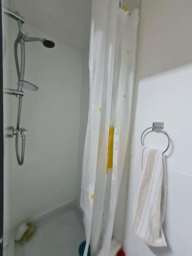 a shower with a white shower curtain and a towel at Room near East Midland Airport Room 6 in Kegworth