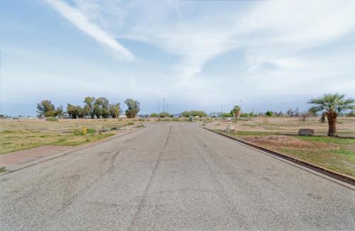 an empty road in the middle of a field at The Fieldhouse in Blythe